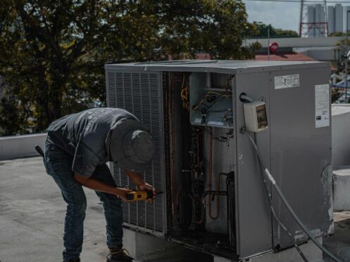 A technician provides spring HVAC maintenance service